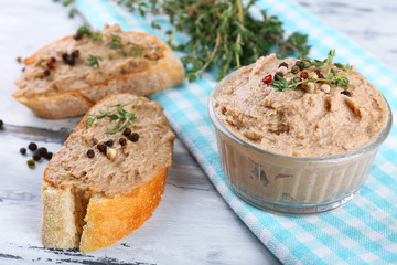 Fresh pate with bread on wooden table