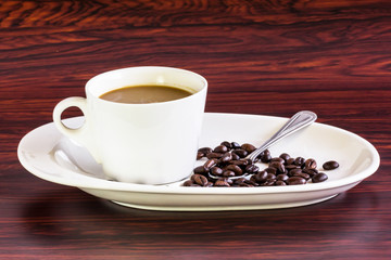 Coffee with cup and seeds
