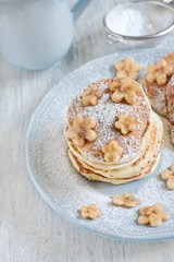 Pancakes with banana and sugar powder