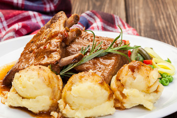 Pork spareribs served with mashed potatoes