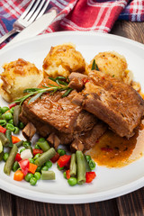 Pork spareribs served with mashed potatoes
