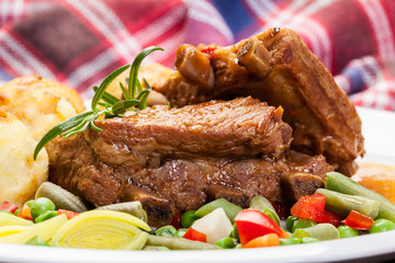 Pork spareribs served with mashed potatoes