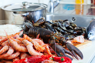 Fresh lobster and other seafood  in home kitchen