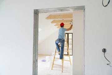 Man painting the walls
