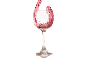 wine and a glass pouring on a white background
