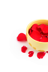 rose petals on a bowl in a white background
