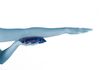 Holding ice gel pack on elbow. Medical concept photo.