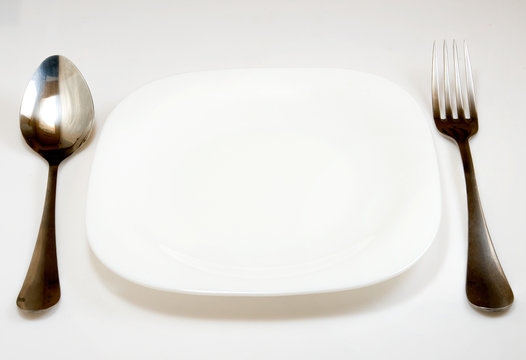 image of spoon fork and plate on white background