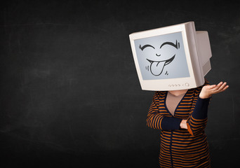 Young girl wearing a monitor with a funny face