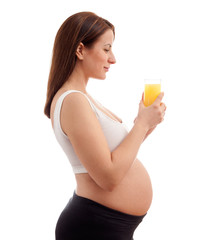 Beautiful pregnant mom with juice
