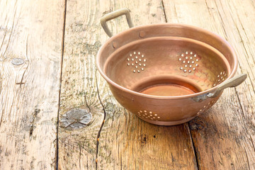 old copper colander