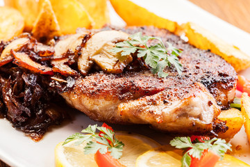 Fried pork chop with mushrooms and chips