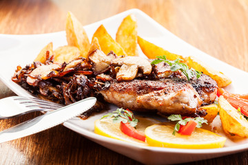 Fried pork chop with mushrooms and chips