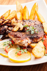 Fried pork chop with mushrooms and chips