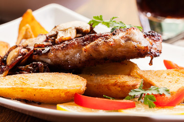 Fried pork chop with mushrooms and chips