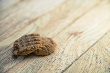 Two cookies on wooden floor2