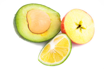 Avocado, lemon, and apple on a white background