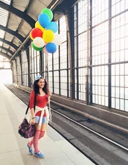 Tuinposter Pretty woman with balloons © christianmutter