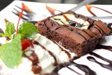Cream cheese brownies on a white plate