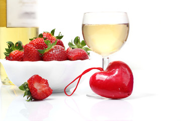 whie  wine bottle and glass and fresh strawberries isolated on w
