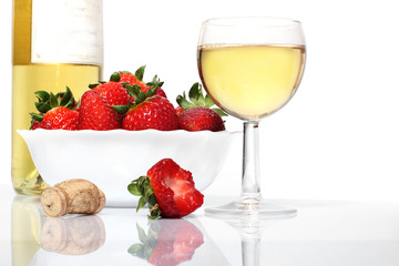 whie  wine bottle and glass and fresh strawberries isolated on w