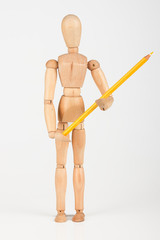 Small wood mannequin standing with colour pencil isolated on whi