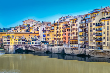 View of colorful houses and Ponte Vecchio bridge in Florence