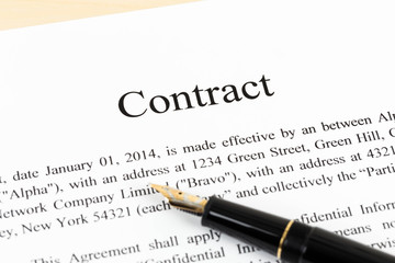 Business contract document with pen