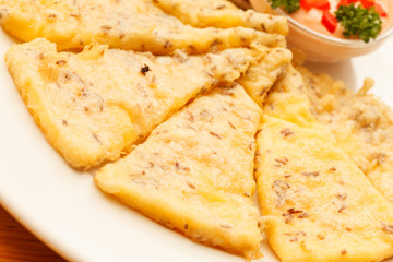 slices of polenta with sauce