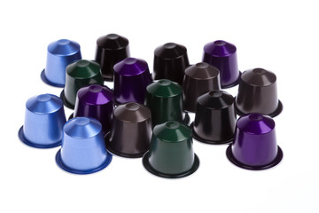 Colorful modern coffee capsules on white background