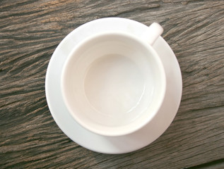 Empty coffee cup on old wooden table