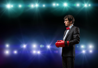 businessman with boxing gloves in the ring