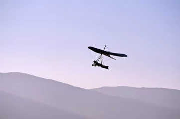 Fotobehang Luchtsport paragliding zweefvliegtuig in de lucht