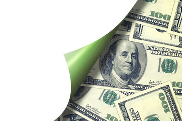 Hundred dollar bills behind curld page