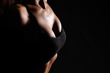 Beautiful female body on a dark background