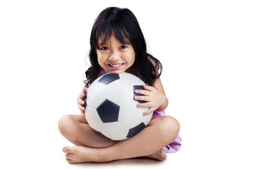 Little girl with soccer ball