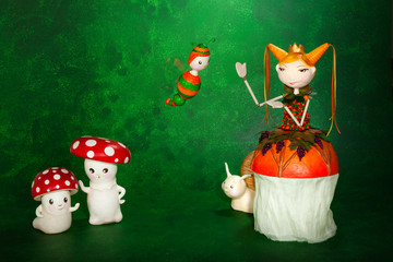 cute puppets handmade, two mushrooms, green background