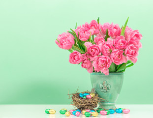 tulip flowers and pastel colored easter eggs