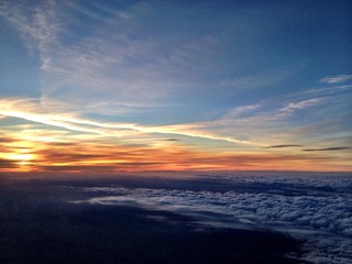 Naklejka na ściany i meble sunset seen during a flight