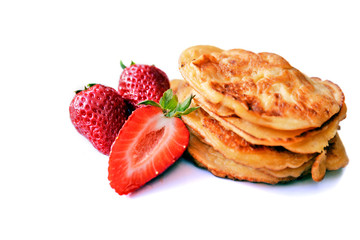 Strawberries and pancakes isolated on white