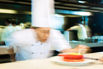Fototapeta na wymiar Asian chefs cooking in Restaurant