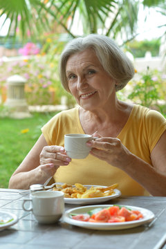 Woman Eating Breakfast