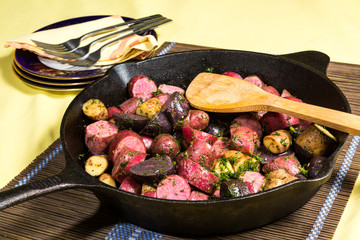 Potato medley meal cooked in a cast iron frying pan