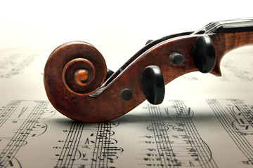 Fototapeta premium Pegbox and scroll of violin on sheed music.