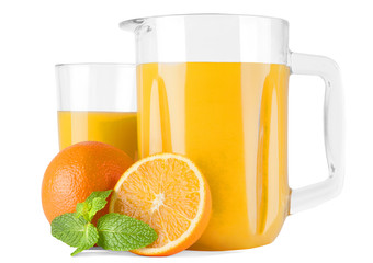 Glass pitcher with orange juice and oranges 