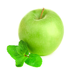 Ripe green apple with cinnamon sticks