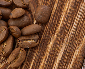 Coffee beans on wood background