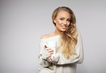 Beautiful young with a hot cup of coffee