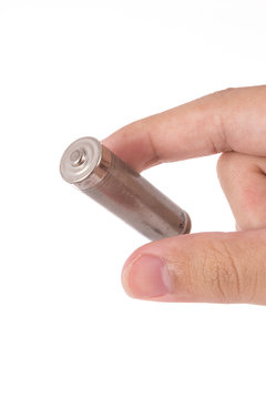 isolated of hand hold is old AA battery on white background