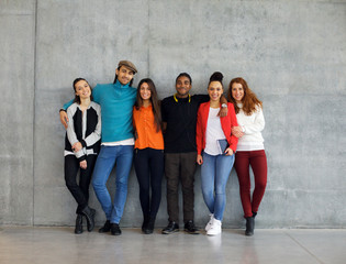 Group of stylish young university students on campus